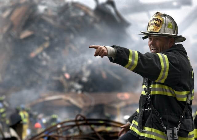 A firefighter pointing during an emergency symbolising urgent response for the German Emergency Vocabulary Quiz.