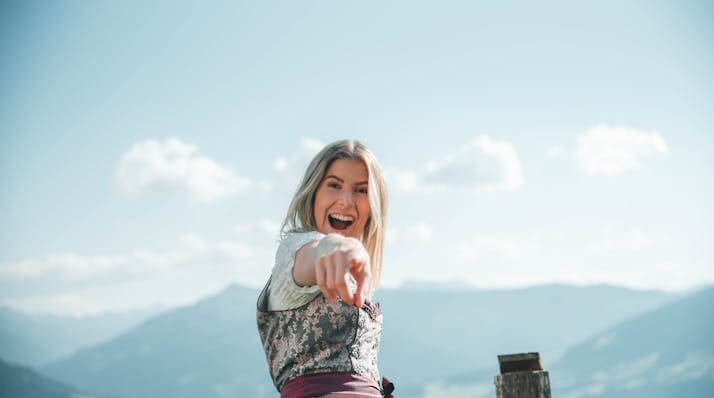 Woman in traditional German dress representing the excitement of mastering the German Adjective Endings Quiz.