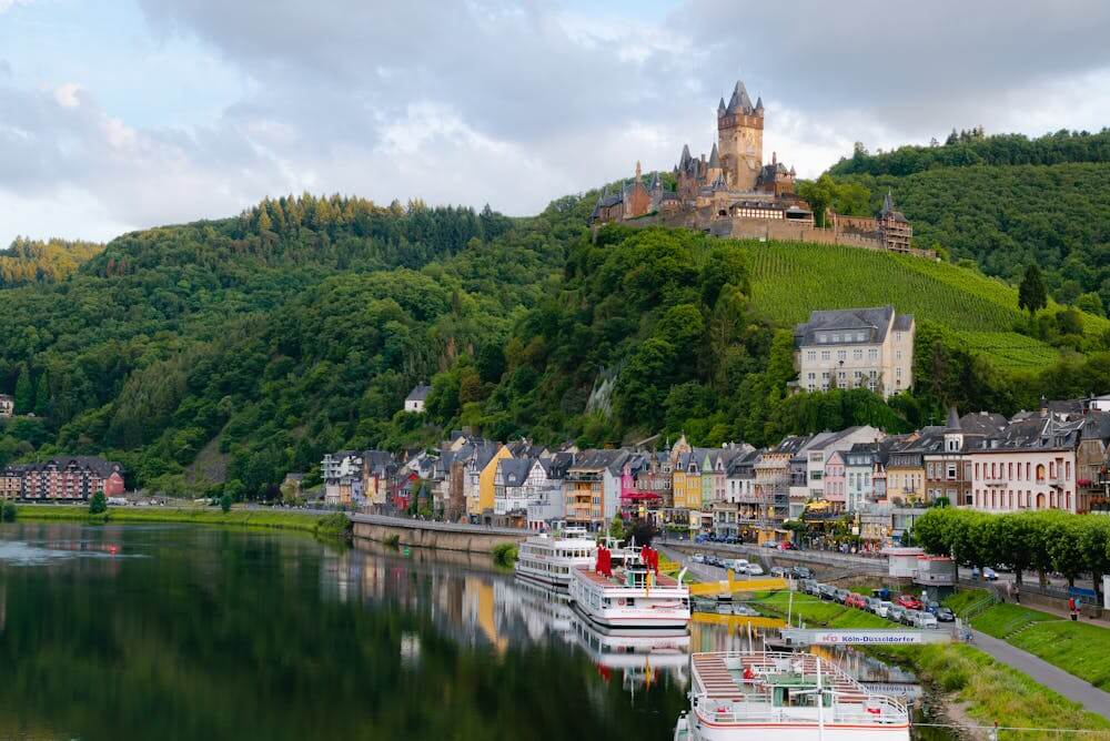 Scenic view of a German town and castle showcasing local prepositions in context.